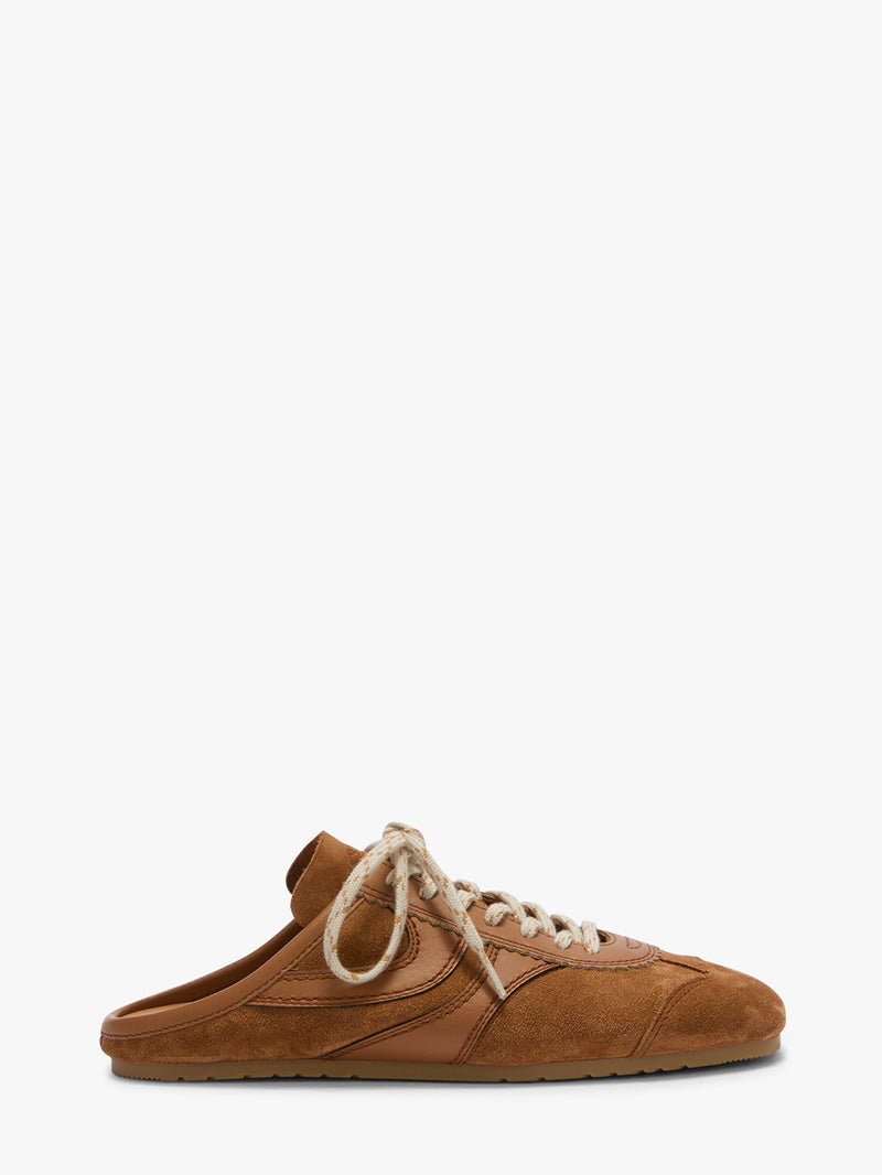Brown suede shoe with white laces on a white background