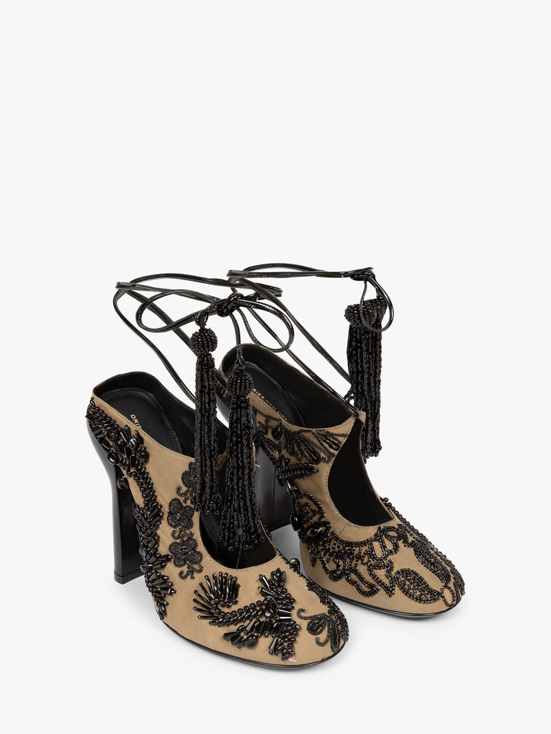Pair of black lace-up high-heeled shoes with tassels on a white background - Dries Van Noten