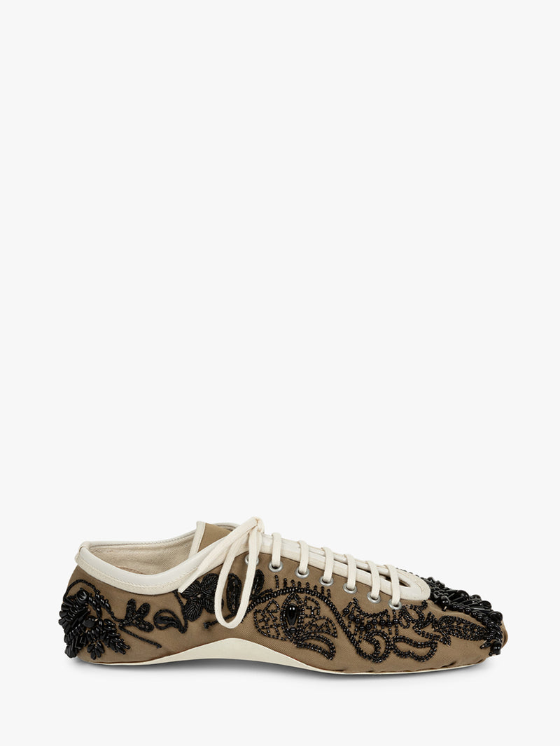 Sneaker with lace design and black embellishments on a white background - Dries Van Noten