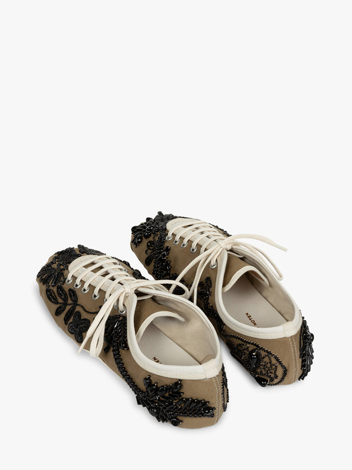 Pair of brown shoes with black lace details on a white background - Dries Van Noten
