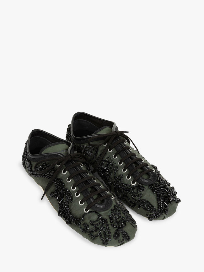 Black lace-up shoes with decorative elements on a white background - Dries Van Noten