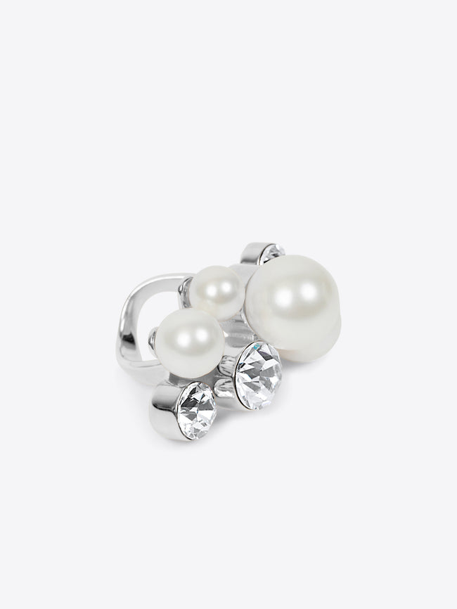 Silver ring with pearls and crystals on a white background