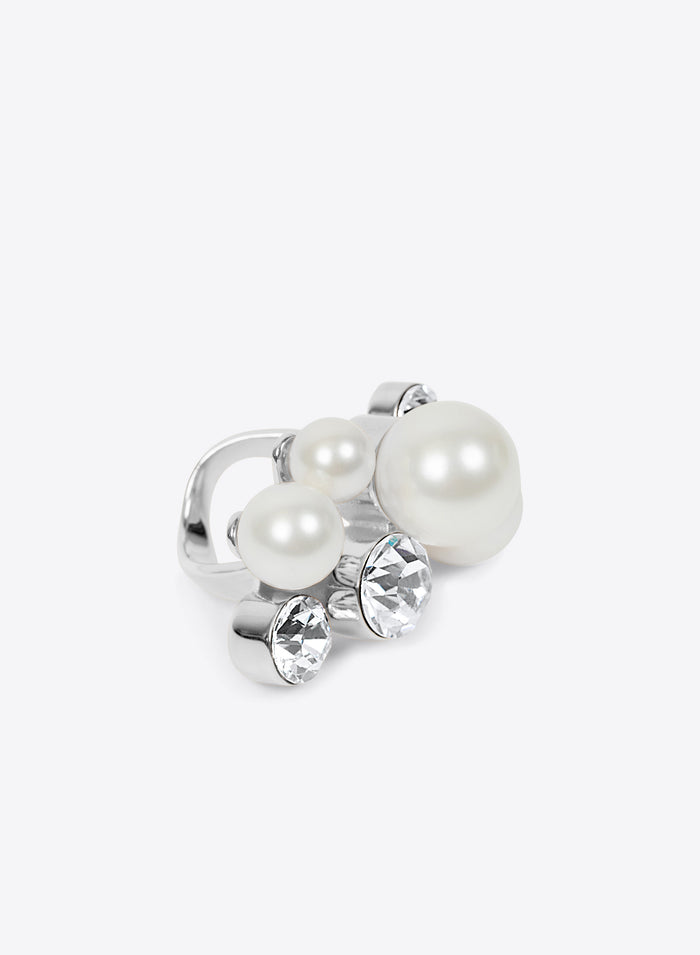 Silver ring with pearls and crystals on a white background