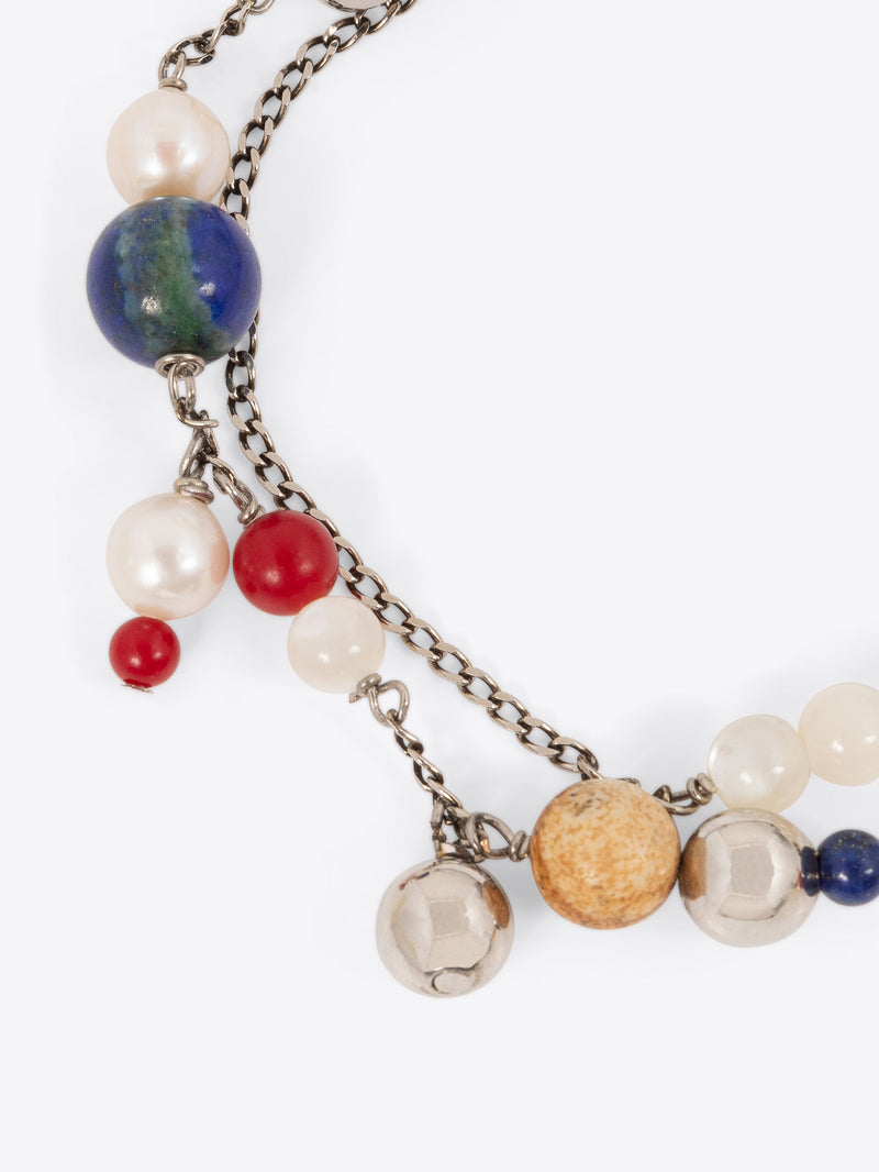 Necklace with multicolored beads and chain on a white background