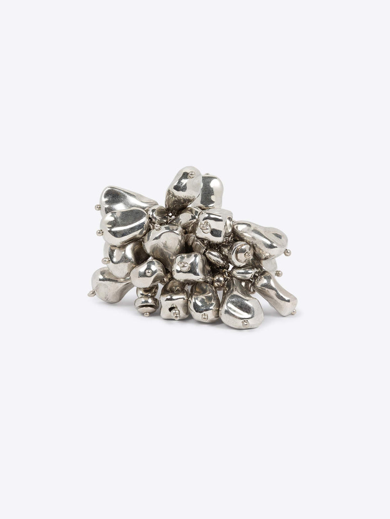 Silver ring with small beads on a white background