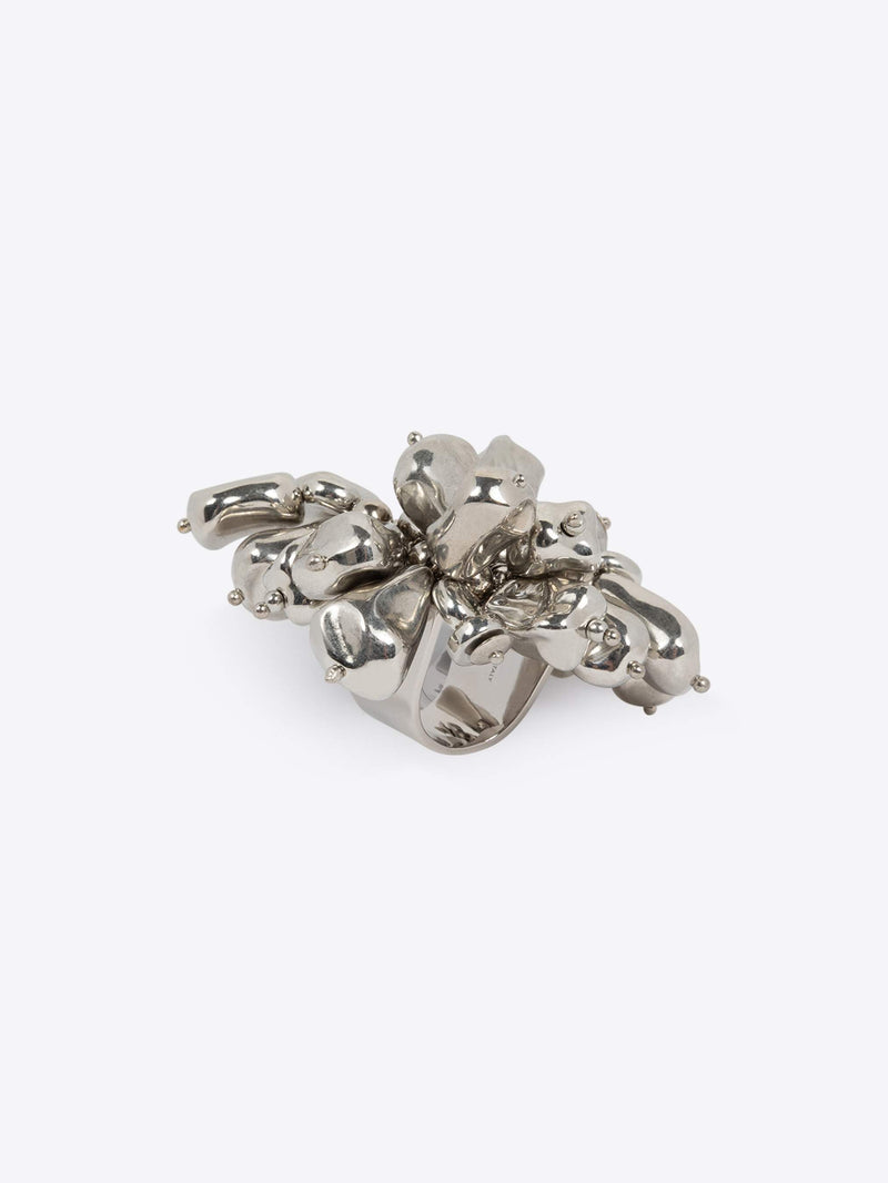 Silver floral ring on a white background