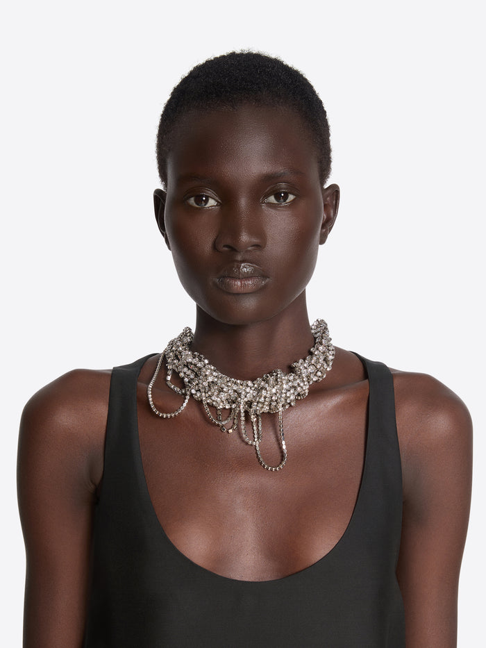 Model wearing a sparkling necklace against a plain background - Dries Van Noten