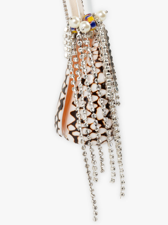 Decorative shell with pearl and crystal embellishments on a white background - Dries Van Noten