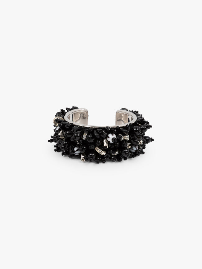 Black studded ring on a white background - Dries Van Noten