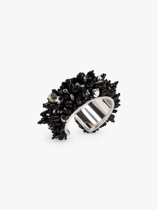 Silver ring with black gemstone cluster on a white background - Dries Van Noten