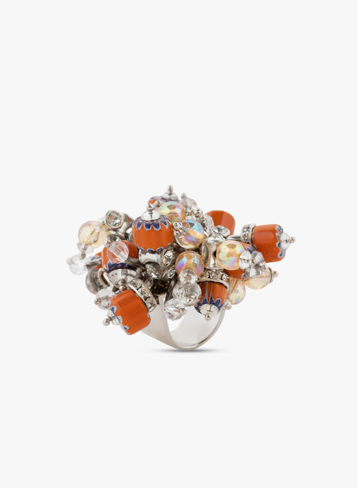 Decorative ring with orange and silver design on a white background - Dries Van Noten