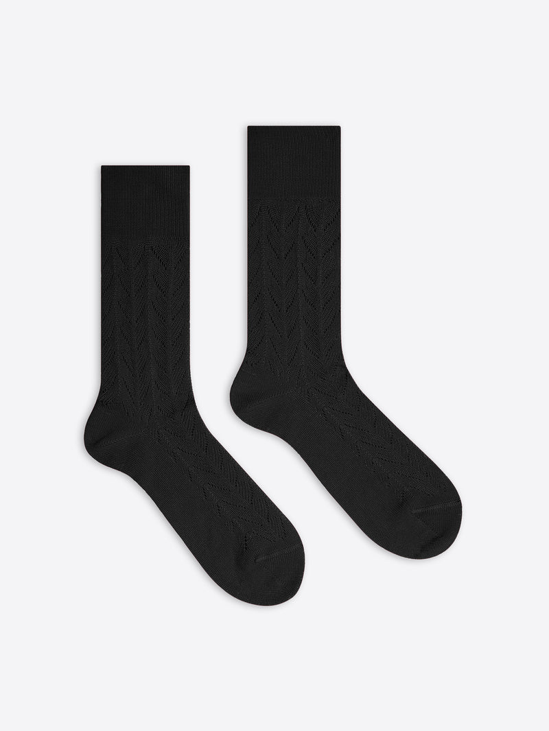 Pair of black socks on a white background