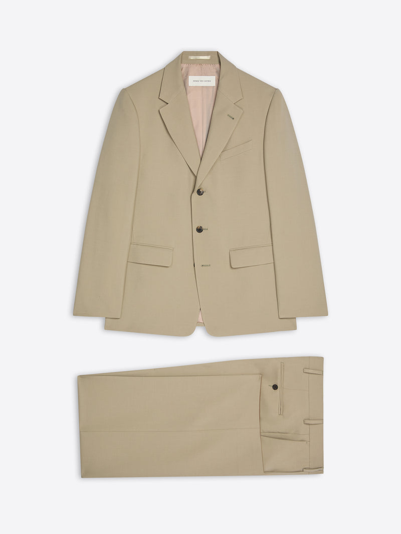 Beige suit jacket and pants on a light beige background