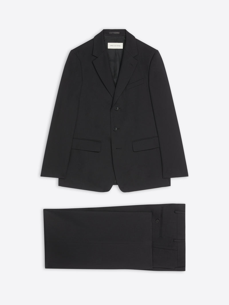 Black suit jacket and pants on a white background