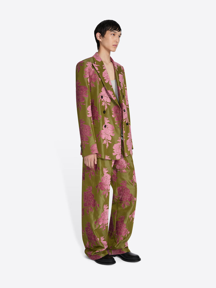 Person wearing a green and pink floral suit on a white background - Dries Van Noten