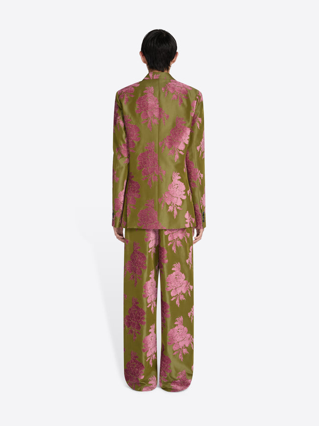 Person wearing a green and pink floral pajama set on a white background - Dries Van Noten