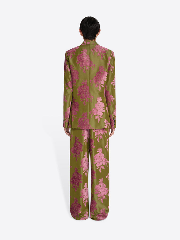 Person wearing a green and pink floral pajama set on a white background - Dries Van Noten