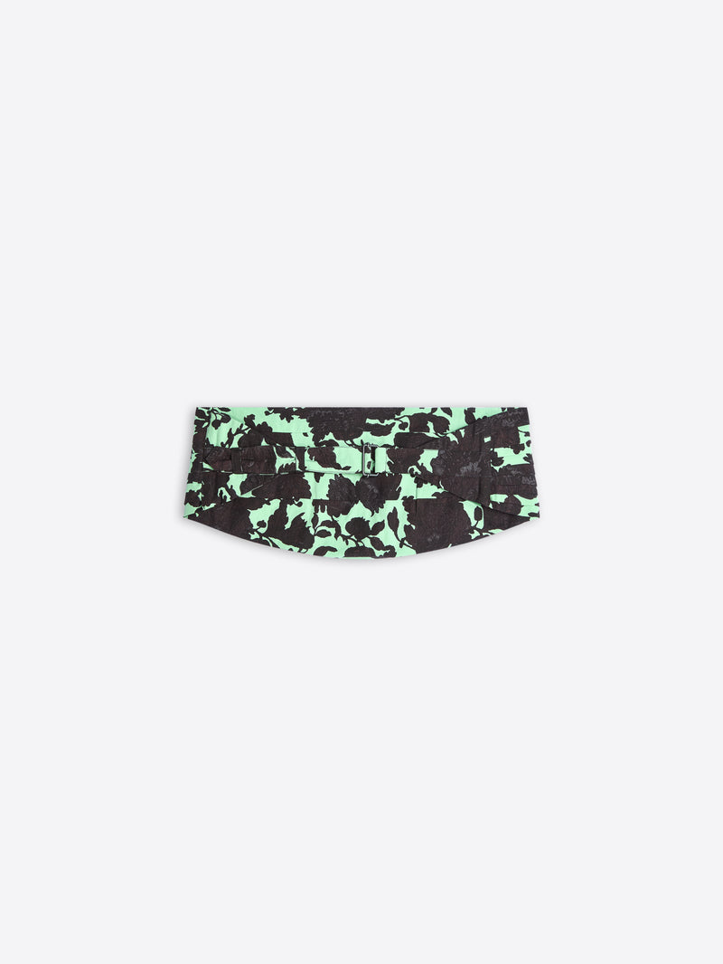 Green and black patterned belt on a white background