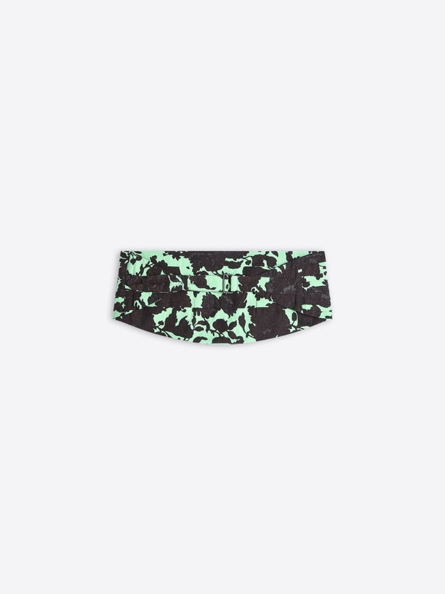 Green and black patterned belt on a white background
