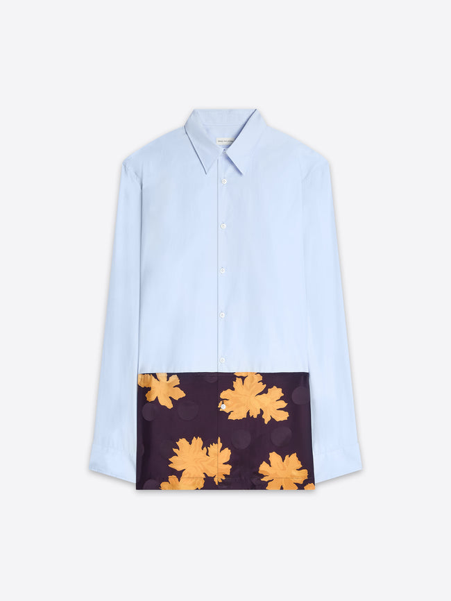 Light blue shirt with a dark panel featuring yellow floral patterns on a white background