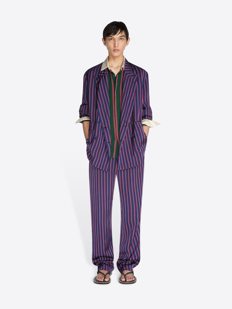 Person wearing a striped outfit on a white background - Dries Van Noten