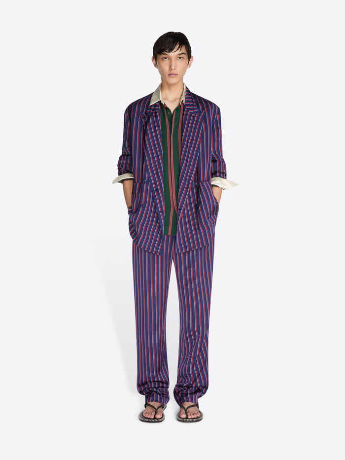 Person wearing a striped outfit on a white background - Dries Van Noten