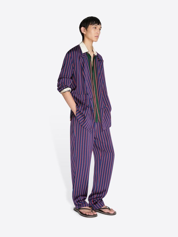 Person wearing a striped outfit on a white background - Dries Van Noten