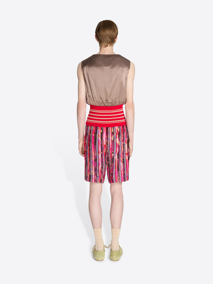 Person wearing a colorful set with a white background - Dries Van Noten