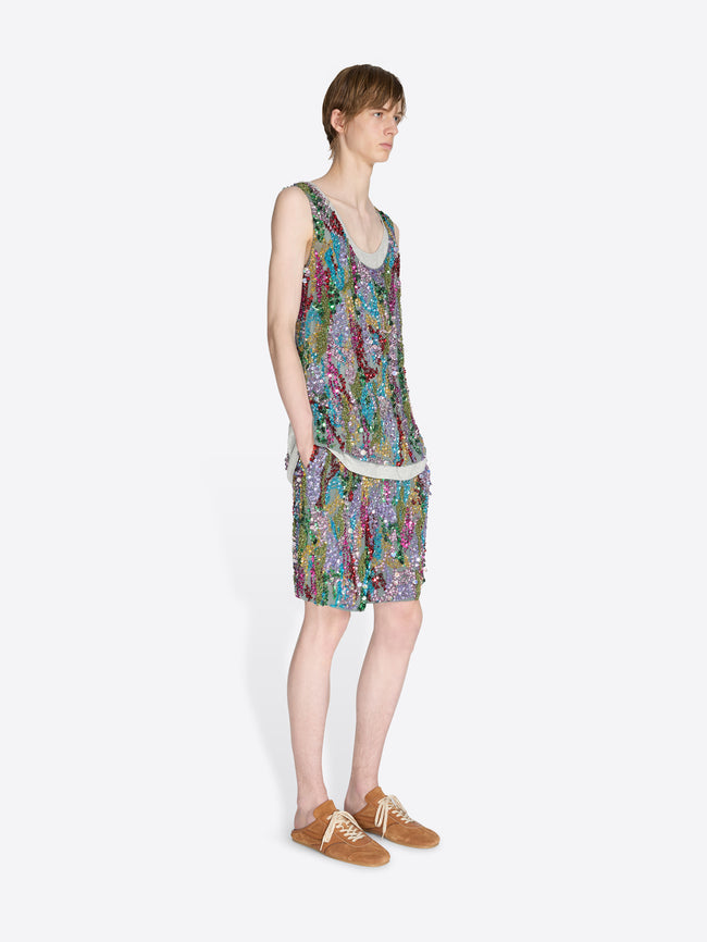 Person wearing a colorful sleeveless dress on a white background - Dries Van Noten