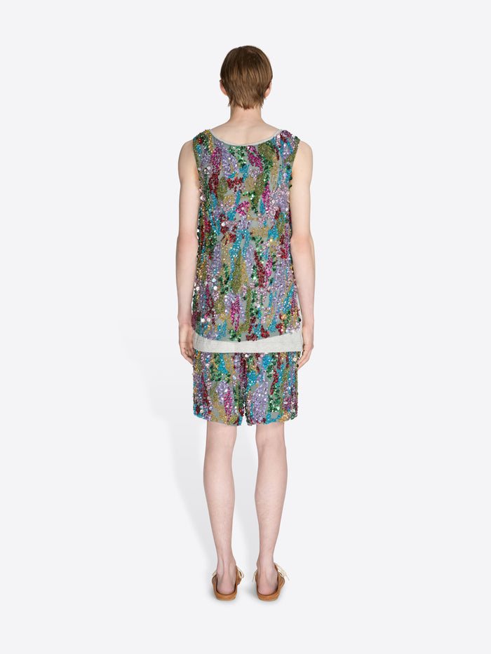 Woman wearing a colorful sequin dress on a white background - Dries Van Noten