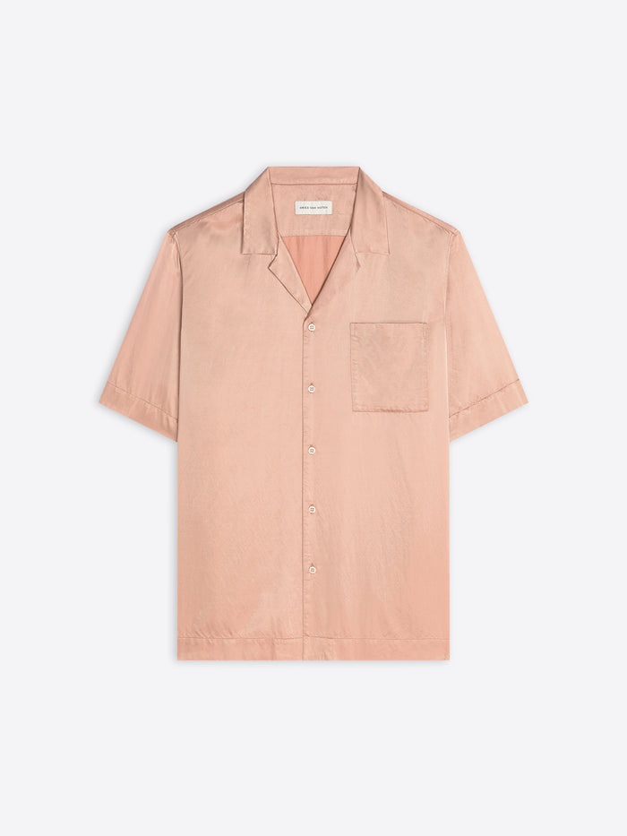 Pink short-sleeve shirt on a light gray background