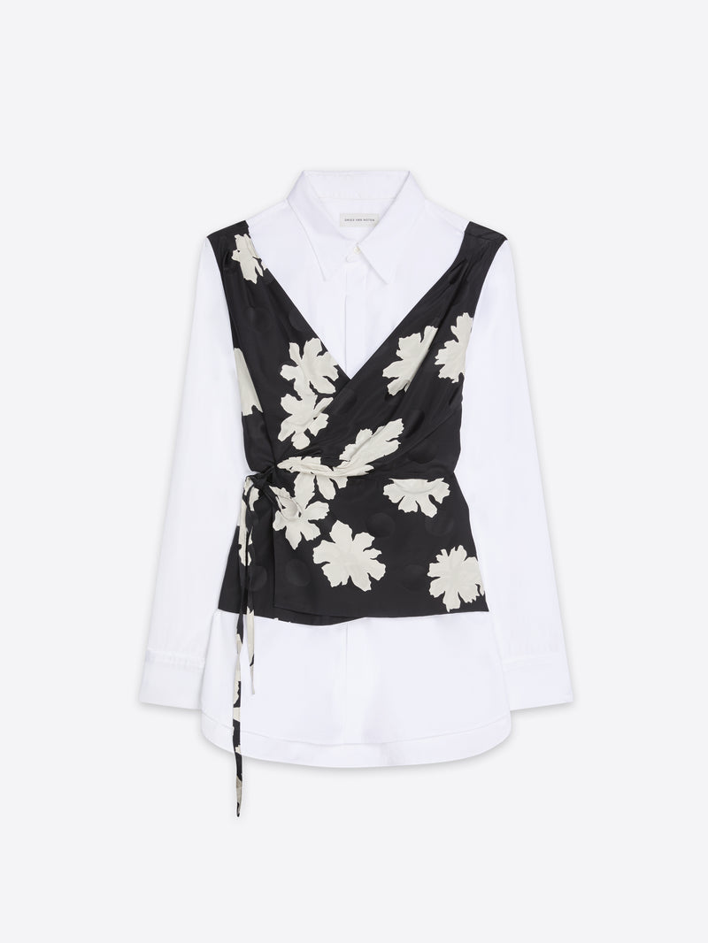 White blouse with a black floral wrapover design on a white background