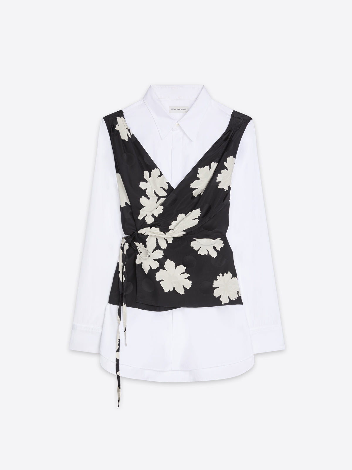 White blouse with a black floral wrapover design on a white background