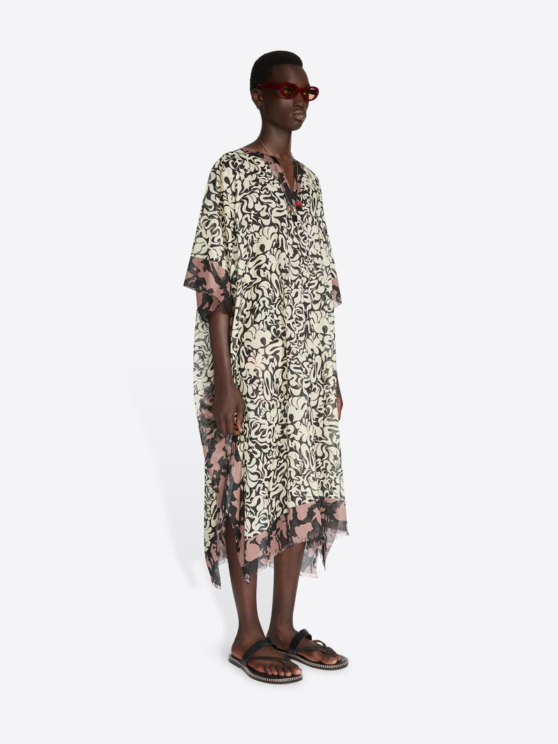 Woman wearing a floral dress on a white background