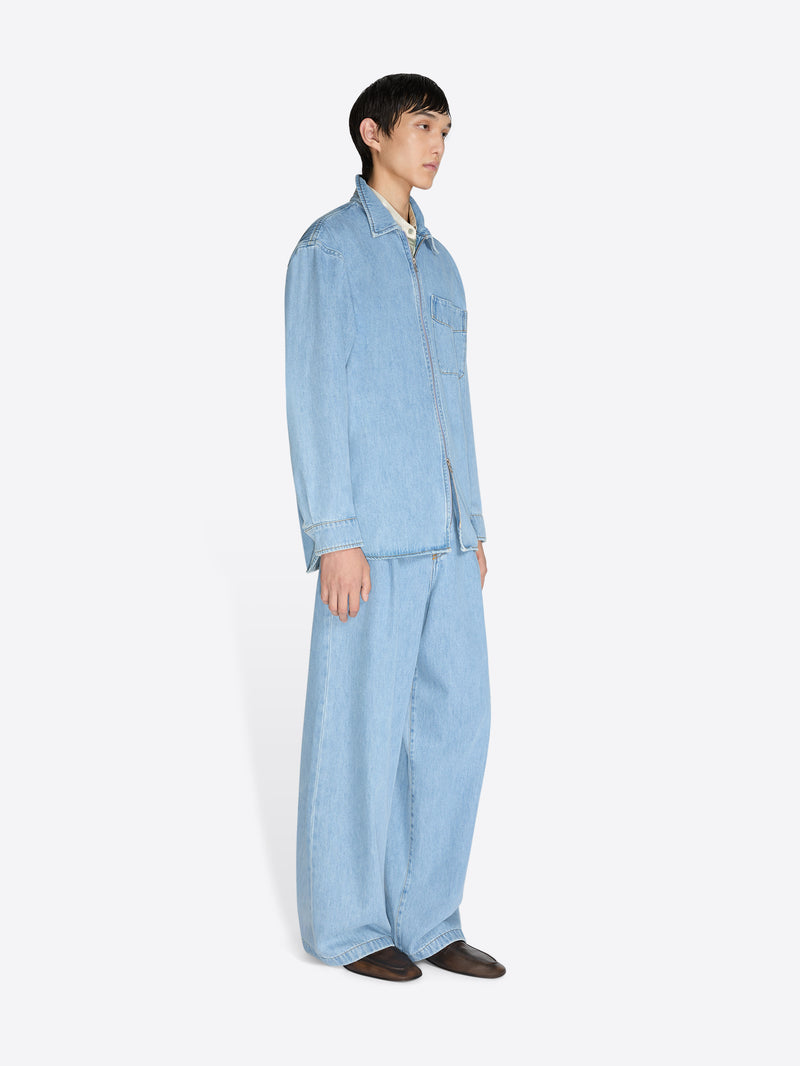 Person wearing a light blue denim outfit on a white background - Dries Van Noten