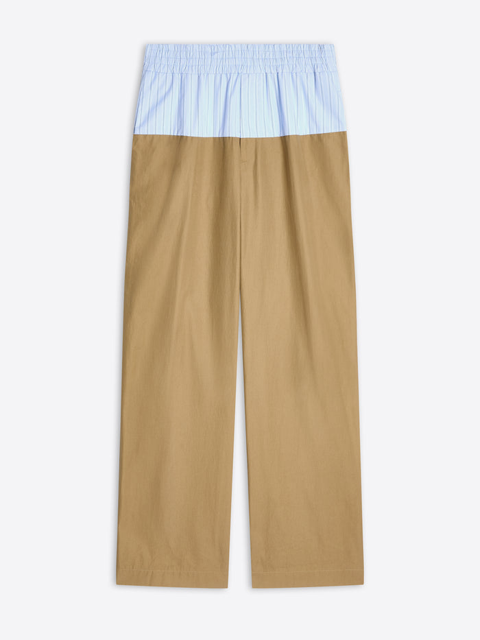 Beige pants with a light blue top section on a white background