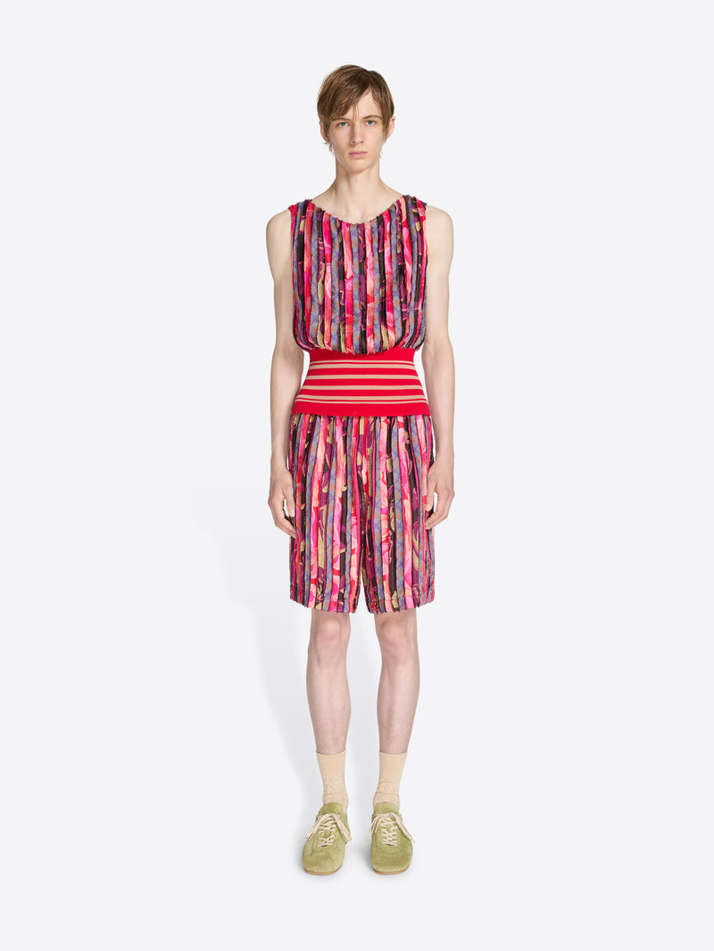 Person wearing a colorful set with a white background - Dries Van Noten