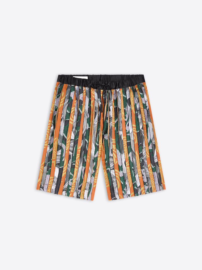 Patterned shorts with orange accents on a white background