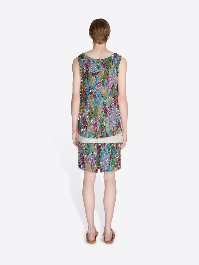 Woman wearing a colorful sequin set on a white background - Dries Van Noten