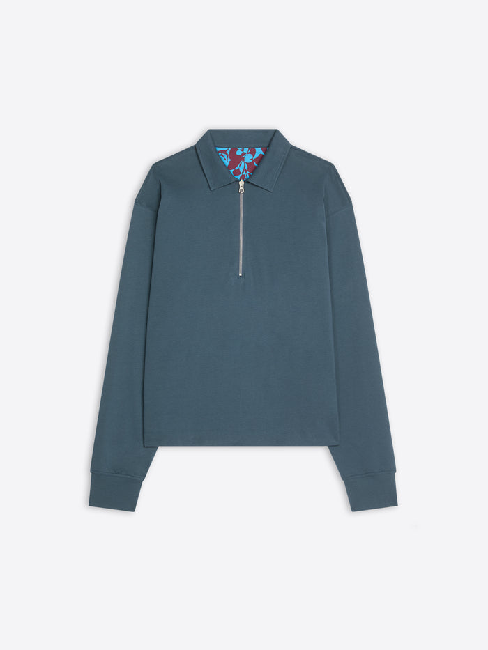 Blue long-sleeve shirt with a floral collar on a white background