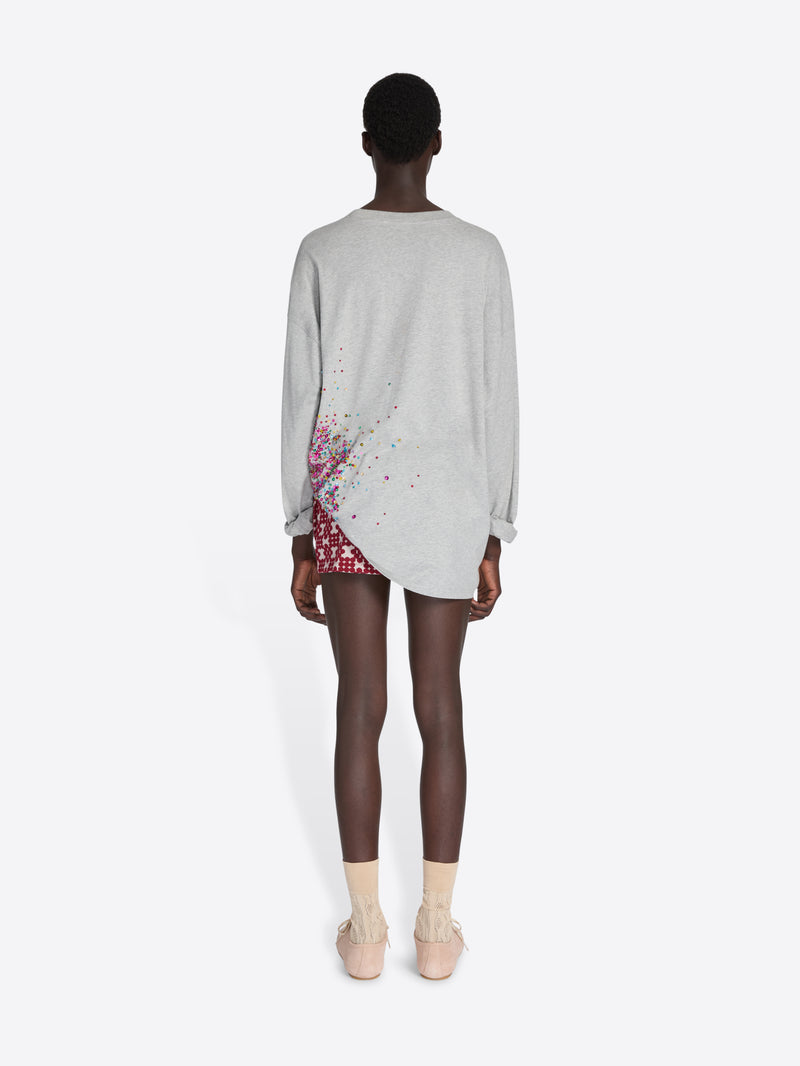 Person wearing a light gray dress with floral pattern on a white background - Dries Van Noten