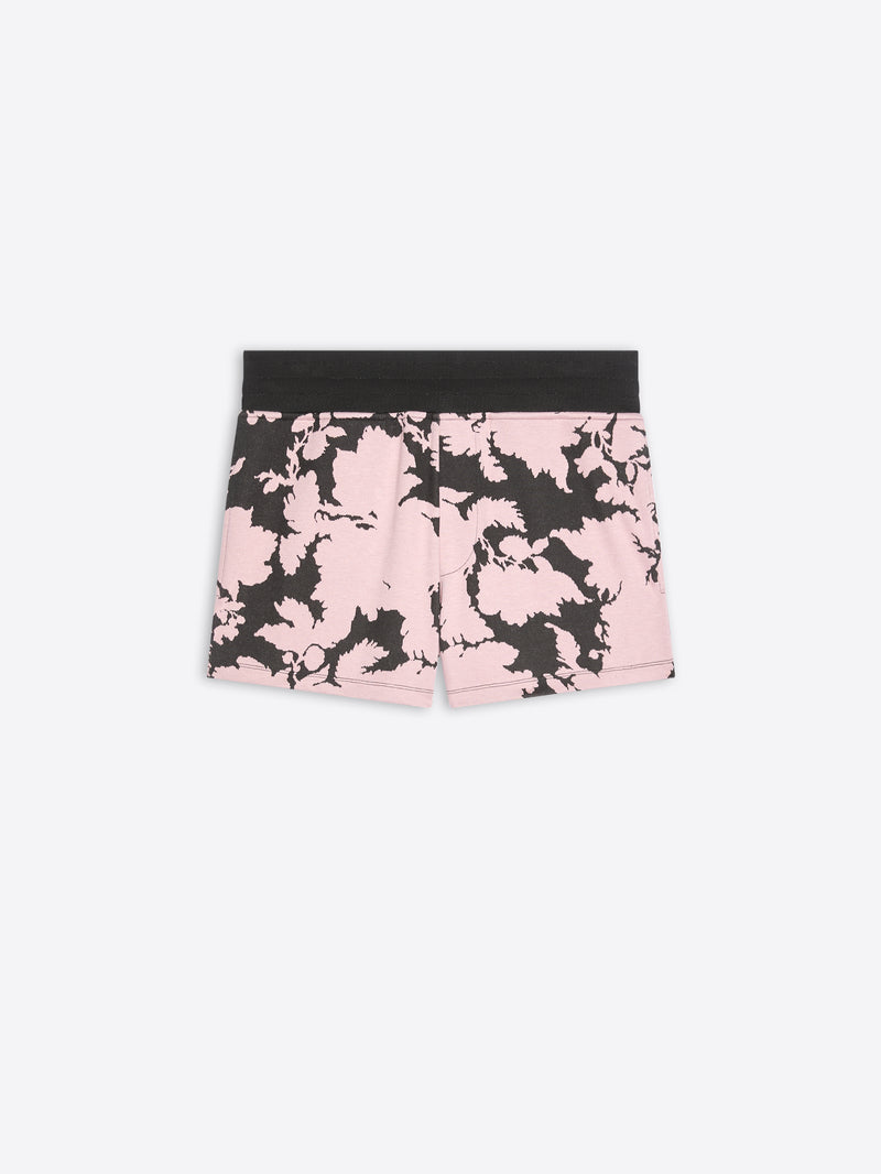 Pink and black floral shorts on a white background