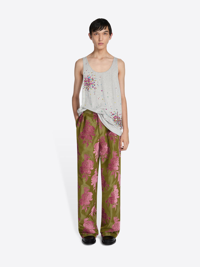 Woman wearing a top and green pants on a white background - Dries Van Noten