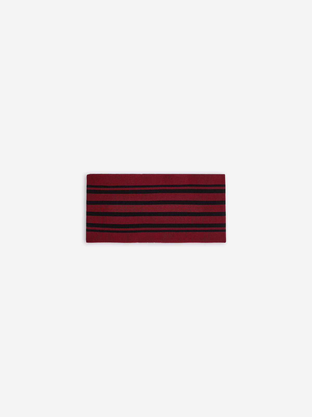 Red and black striped fabric belt on a white background