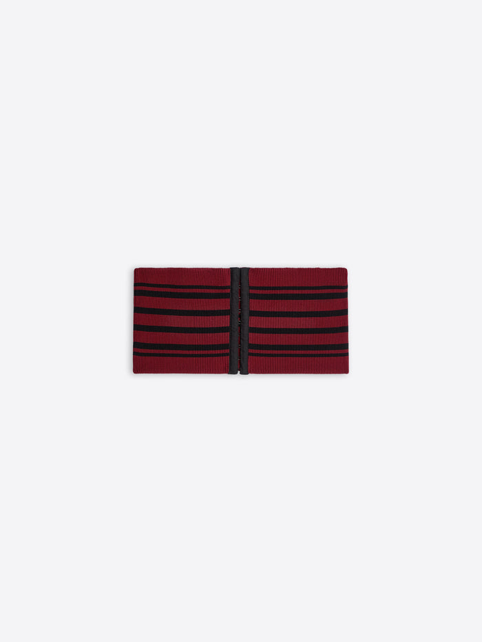 Red and black striped fabric belt on a white background