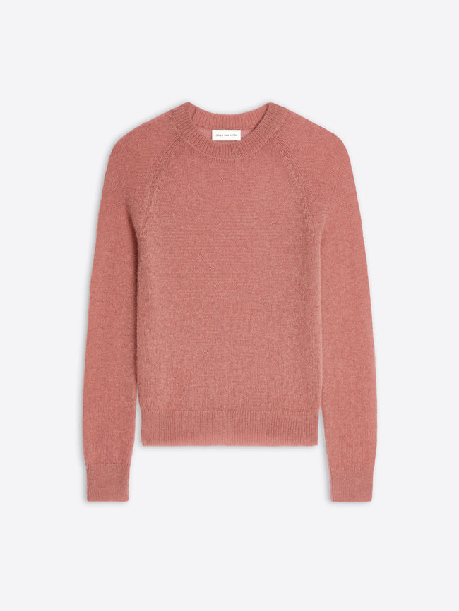 Pink sweater on a light gray background