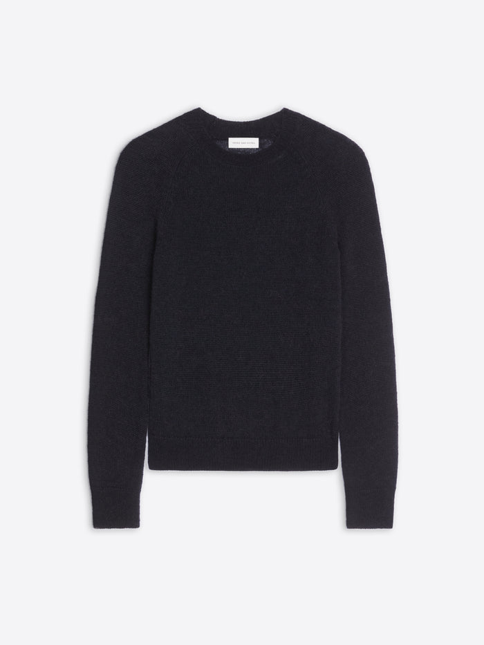 Black sweater on a light gray background