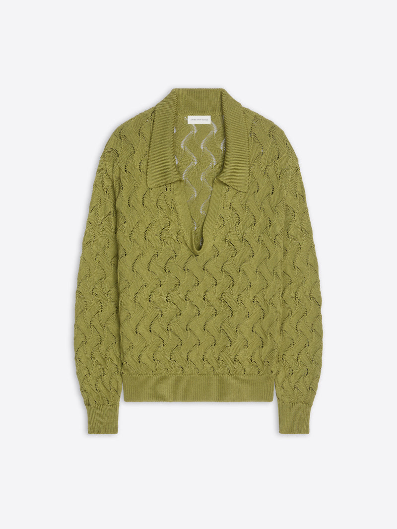 Green sweater with a textured pattern on a white background
