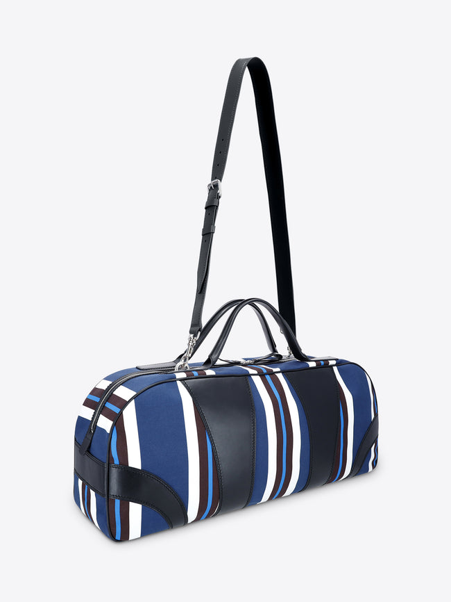 Blue and white striped duffel bag with black accents on a light gray background - Dries Van Noten