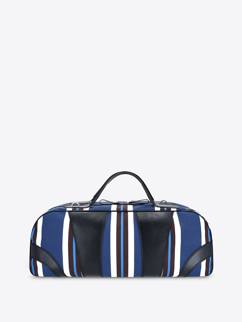 Striped duffel bag with blue, white, and black pattern on a light gray background - Dries Van Noten